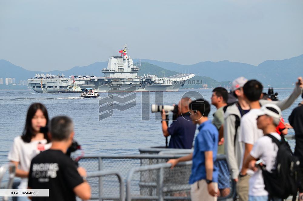 Aircraft Carrier Shandong Sailing In Hong Kong Waters