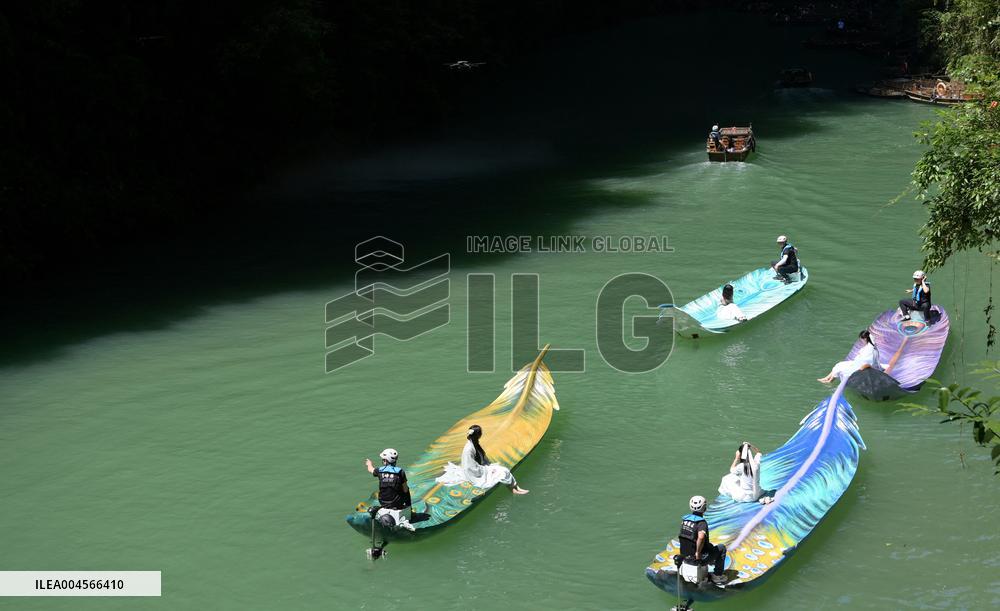 Tourists Take Feather-Shaped Boats - China
