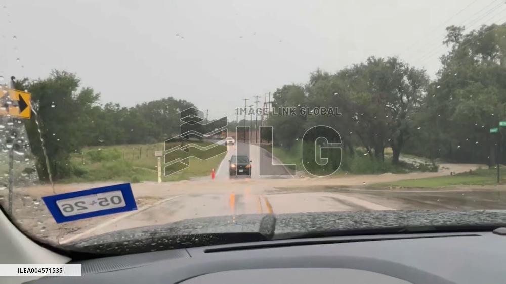 US: Vehicles Drive Through Flooded Intersection in Williamson County, Texas