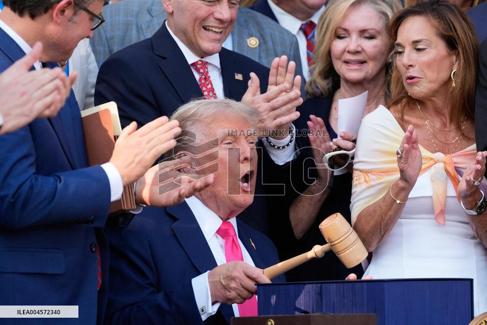 Trump Signs Tax Bill And Watches July 4th Parade