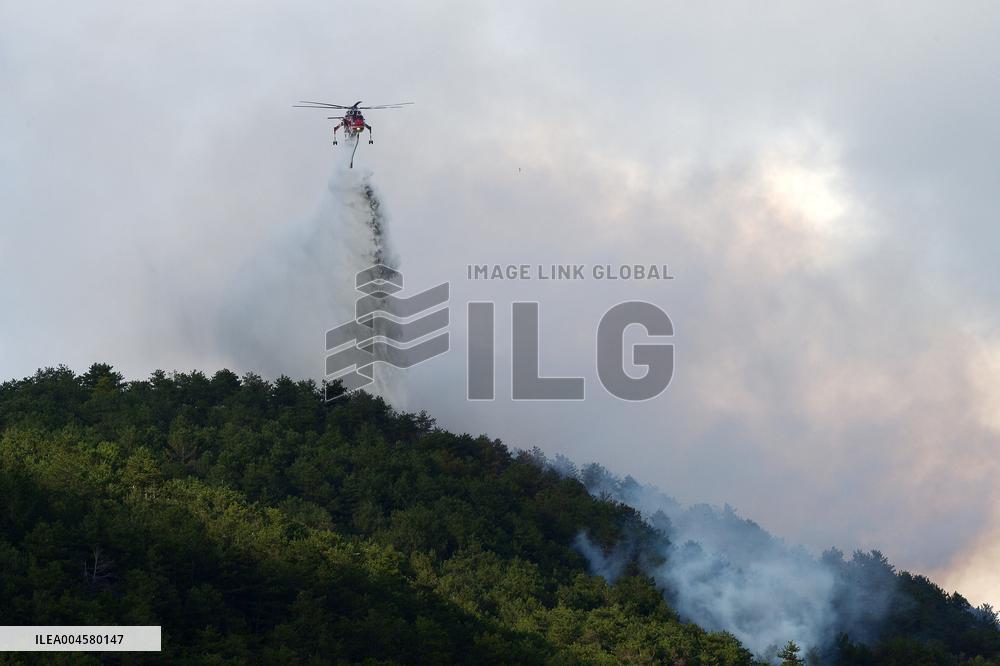 Air Rescue Operations During a Mountain Fire - Italy