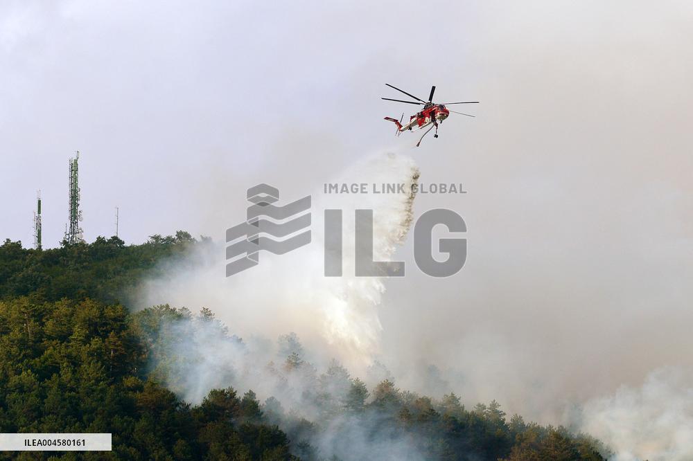 Air Rescue Operations During a Mountain Fire - Italy