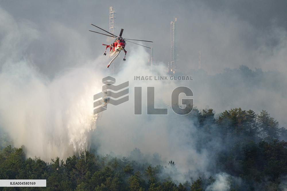 Air Rescue Operations During a Mountain Fire - Italy
