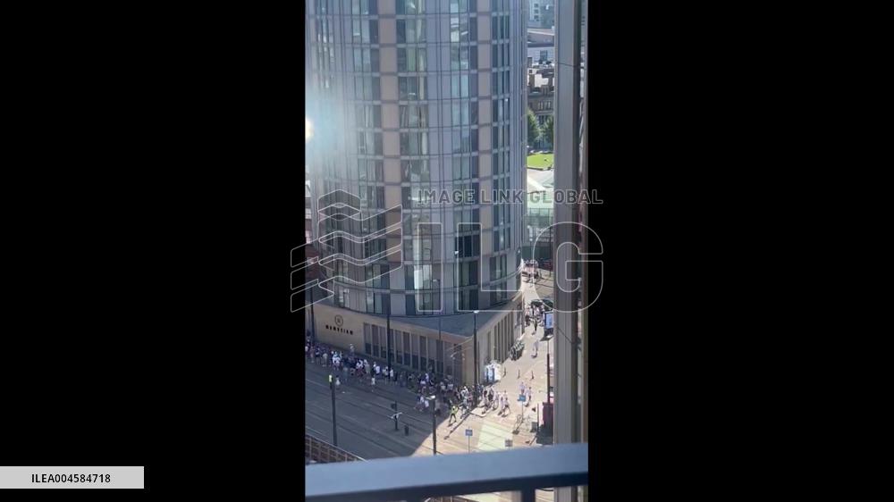 UK: Oasis Fans Form Long Queues for Trams at Manchester Victoria Station