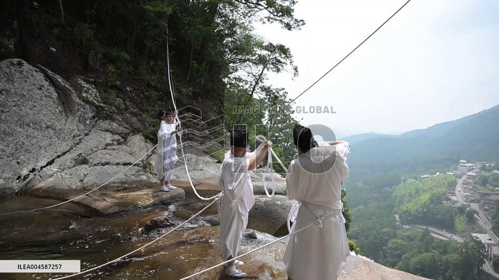 Sacred rope replaced at western Japan waterfall