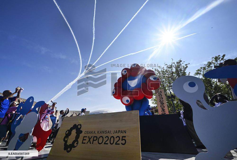 Blue Impulse aerobatic team flies over Osaka