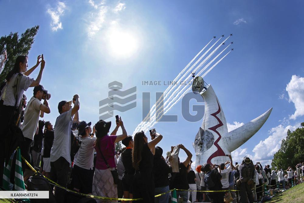 Blue Impulse aerobatic team flies over Osaka