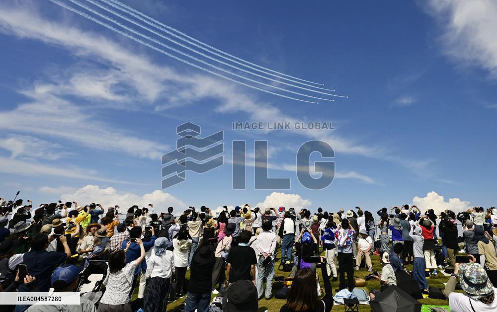 Blue Impulse aerobatic team flies over Osaka