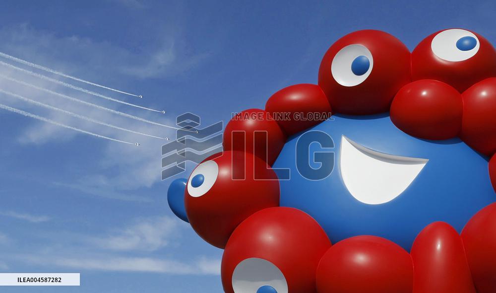 Blue Impulse aerobatic team flies over Osaka