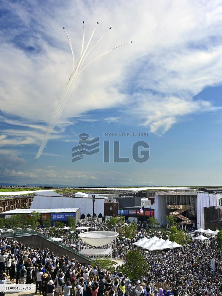 Blue Impulse aerobatic team flies over Osaka