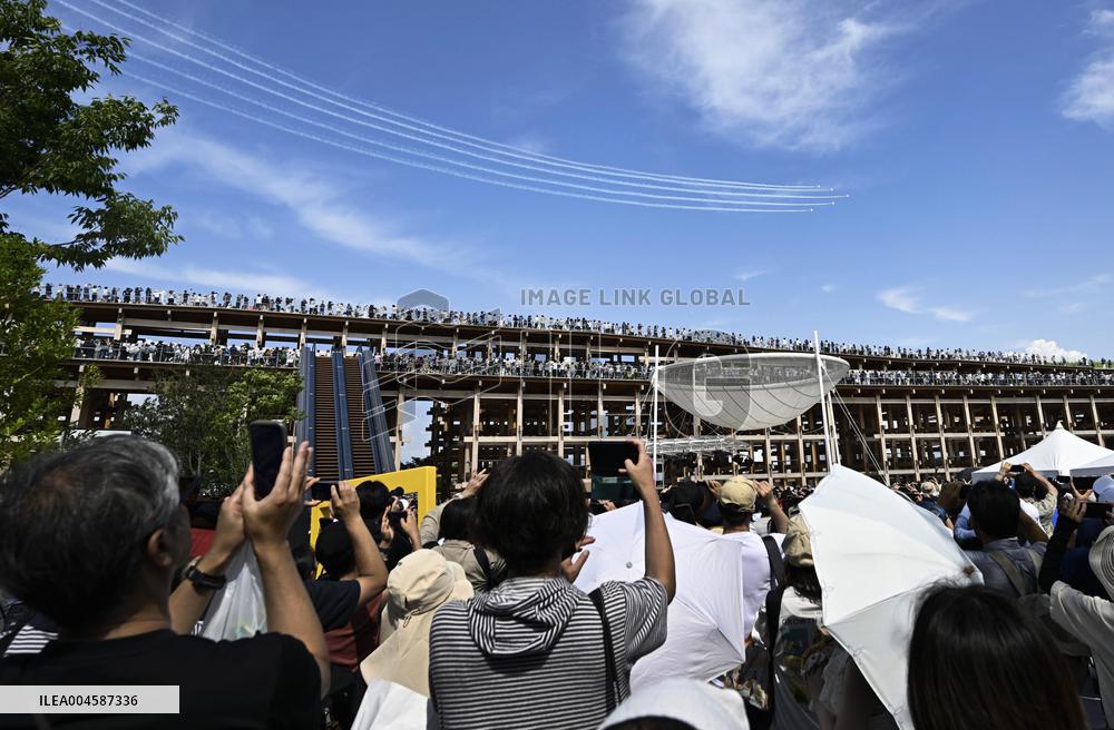 Blue Impulse aerobatic team flies over Osaka