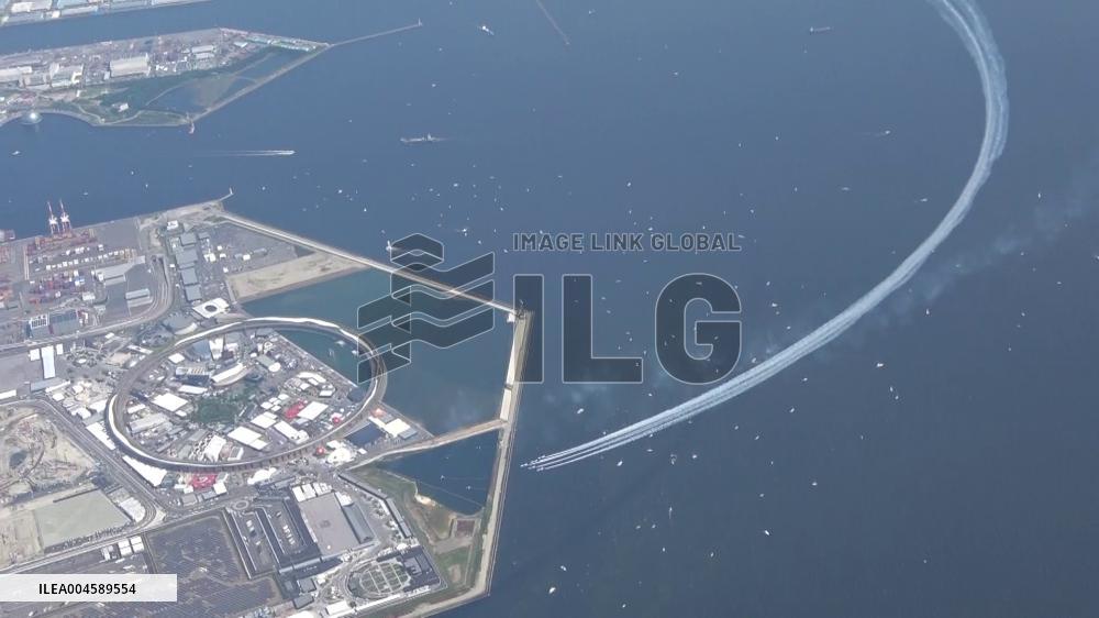 Blue Impulse aerobatic team flies over Osaka