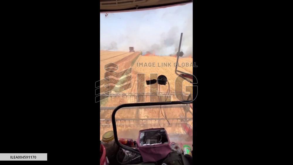 China: Brothers Drive Harvester Into Wheat Field Fire to Stop Spread