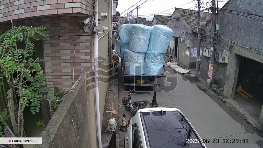 China: Overloaded Truck Causes Scooter Accident in Ningbo