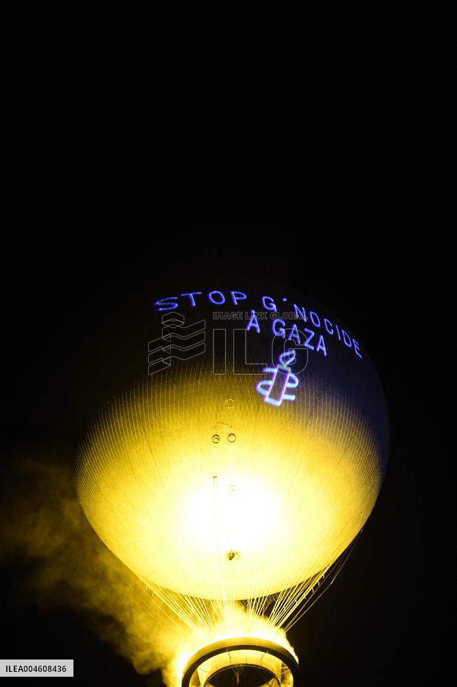 Amnesty International Action - "Stop genocide in Gaza" onto the Paris 2024 Olympic cauldron - Paris