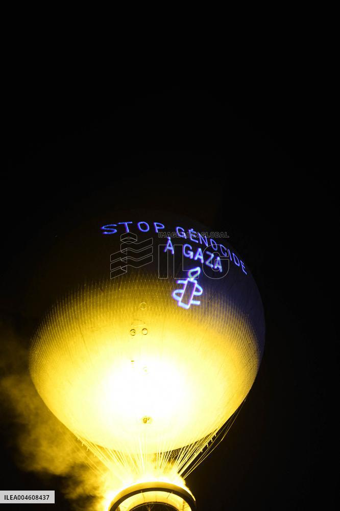 Amnesty International Action - "Stop genocide in Gaza" onto the Paris 2024 Olympic cauldron - Paris