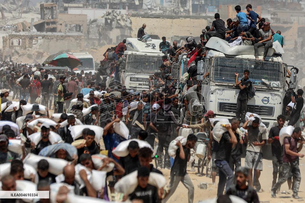 Palestinians Carry Flour As Humanitarian Aid Reaches Gaza