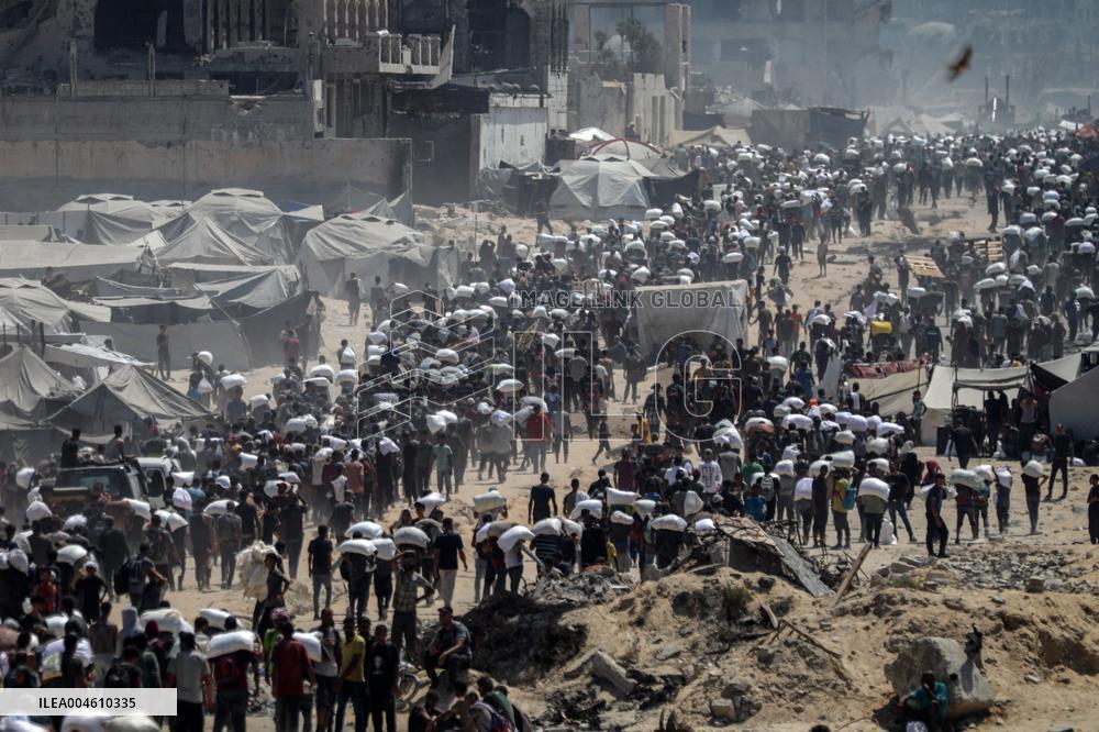 Palestinians Carry Flour As Humanitarian Aid Reaches Gaza