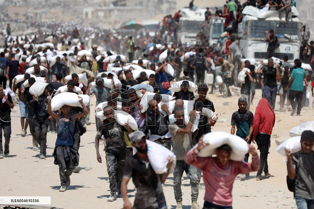 Palestinians Carry Flour As Humanitarian Aid Reaches Gaza