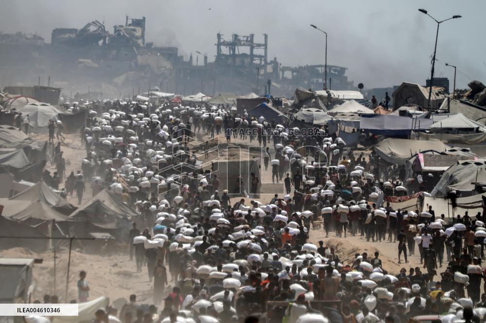 Palestinians Carry Flour As Humanitarian Aid Reaches Gaza