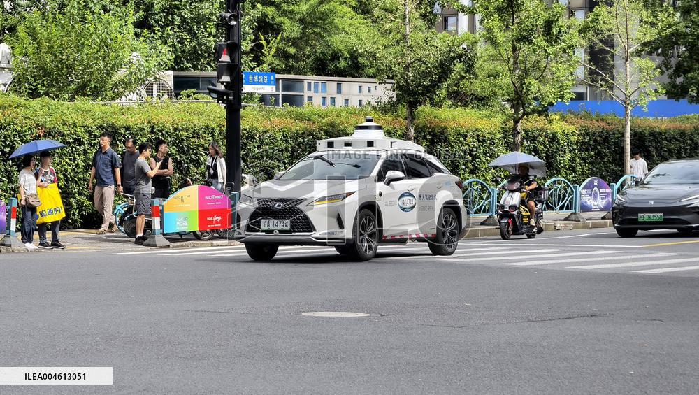 L4-level AI Autonomous Driving Car Experience Event at the 2025 WAIC in Shanghai