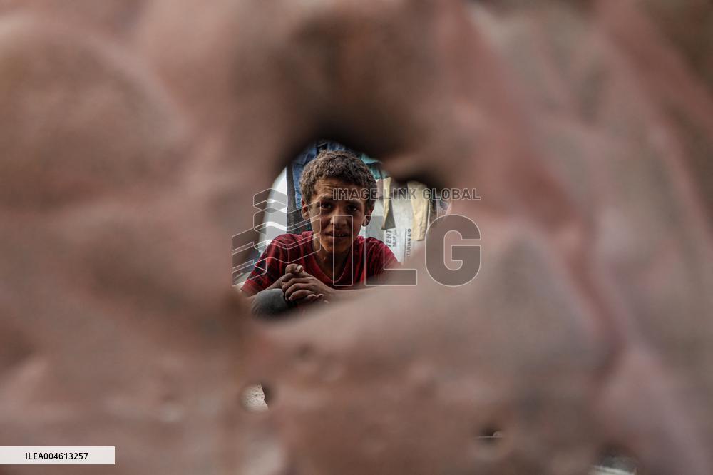 Displaced Family Prepares Meal Amid Food Shortages - Gaza City