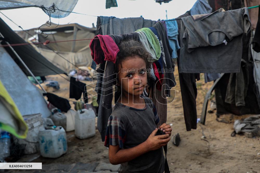 Displaced Family Prepares Meal Amid Food Shortages - Gaza City