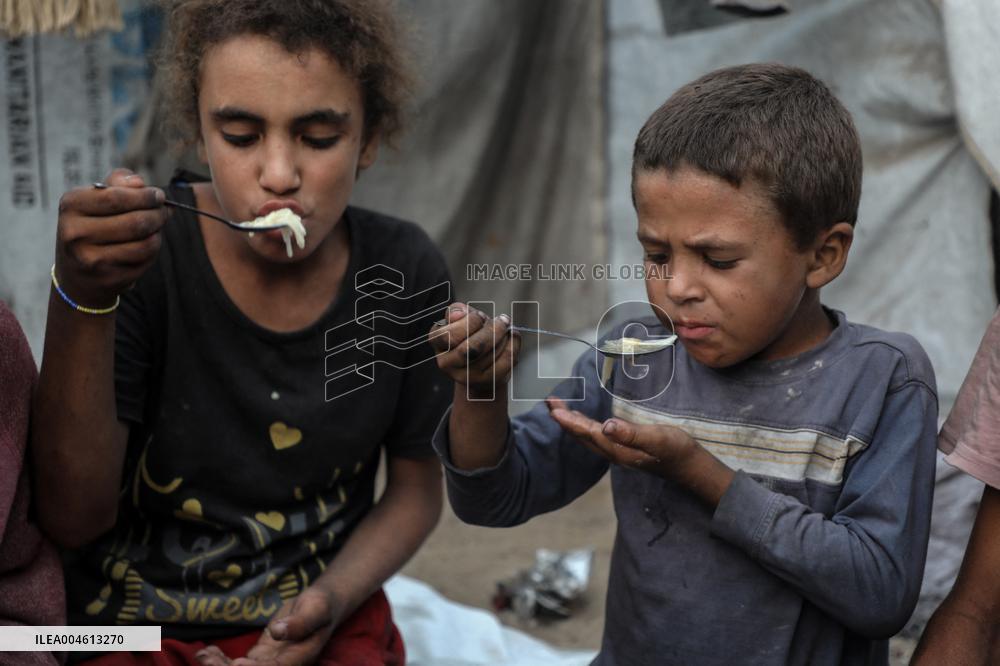 Displaced Family Prepares Meal Amid Food Shortages - Gaza City