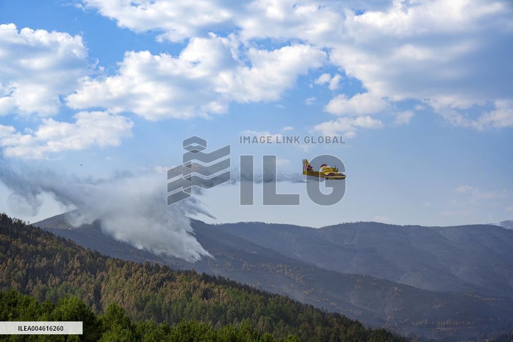 Troops Work to Control Fire Near Avellanar Caceres - Spain