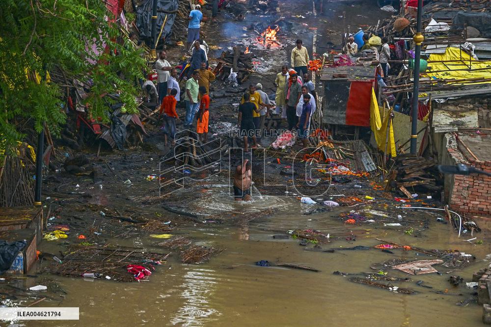 Flood Forces Cremations to Higher Ground