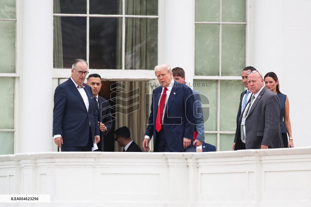 DC: President Trump walks on roof of the West Wing of the White House