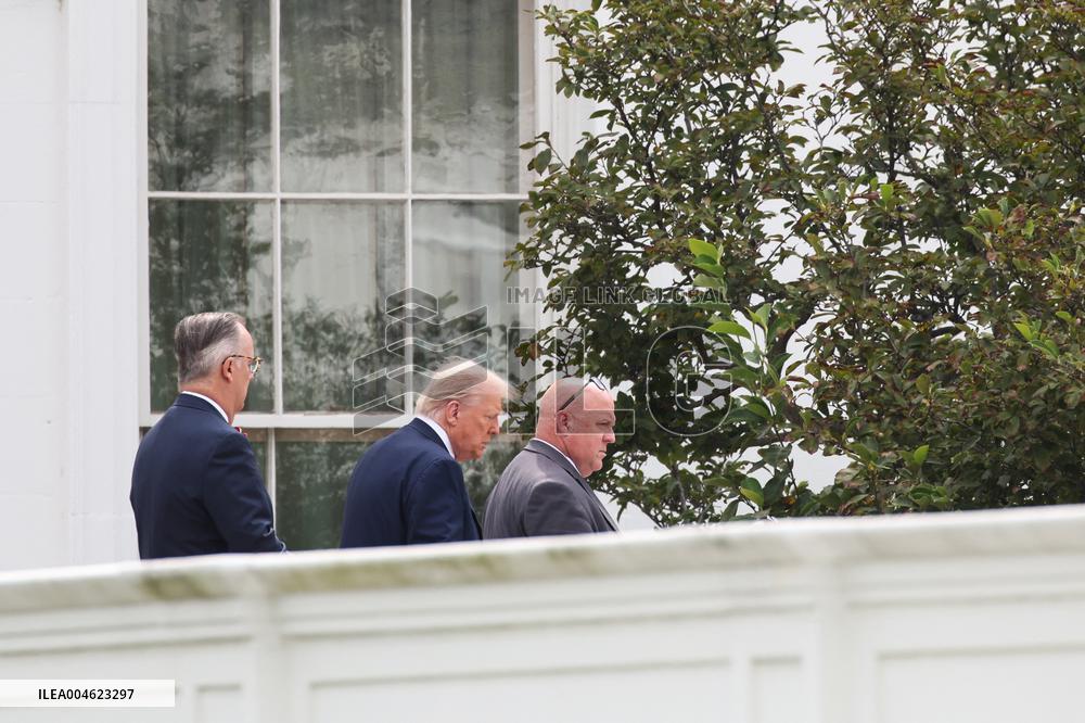 DC: President Trump walks on roof of the West Wing of the White House
