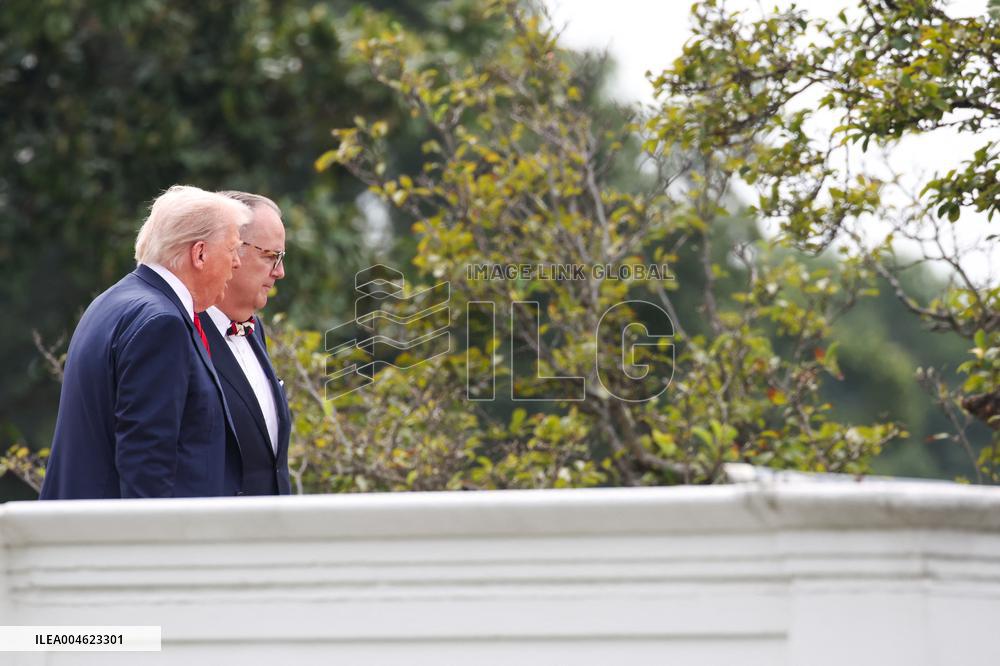 DC: President Trump walks on roof of the West Wing of the White House