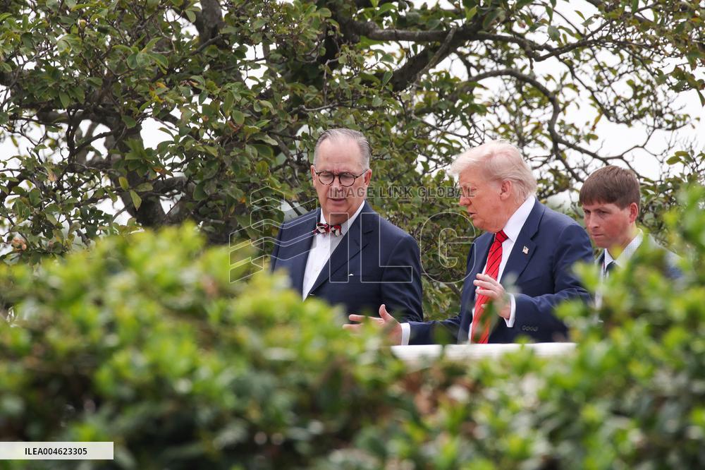 DC: President Trump walks on roof of the West Wing of the White House