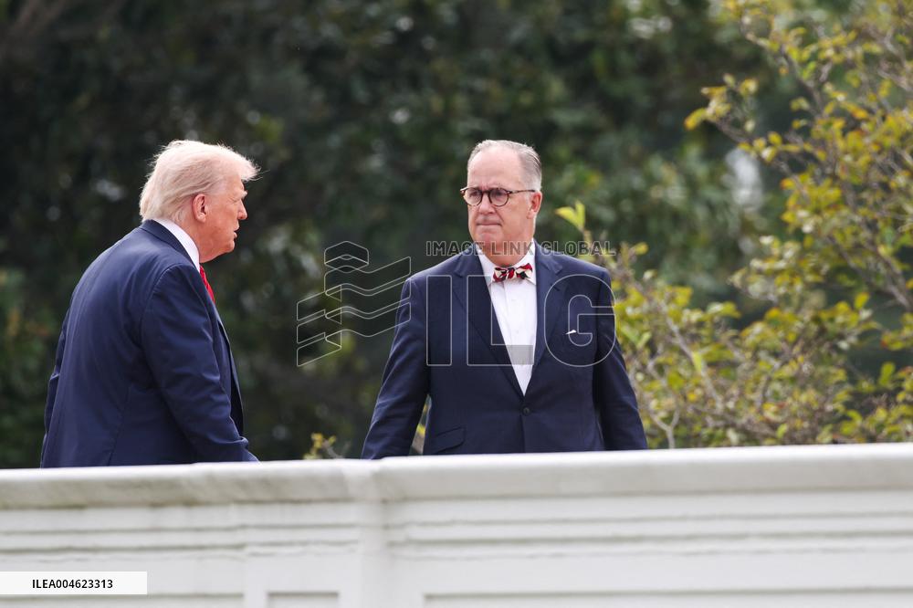 DC: President Trump walks on roof of the West Wing of the White House