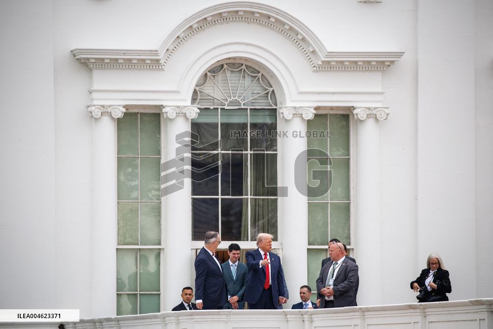 DC: President Trump walks on roof of the West Wing of the White House