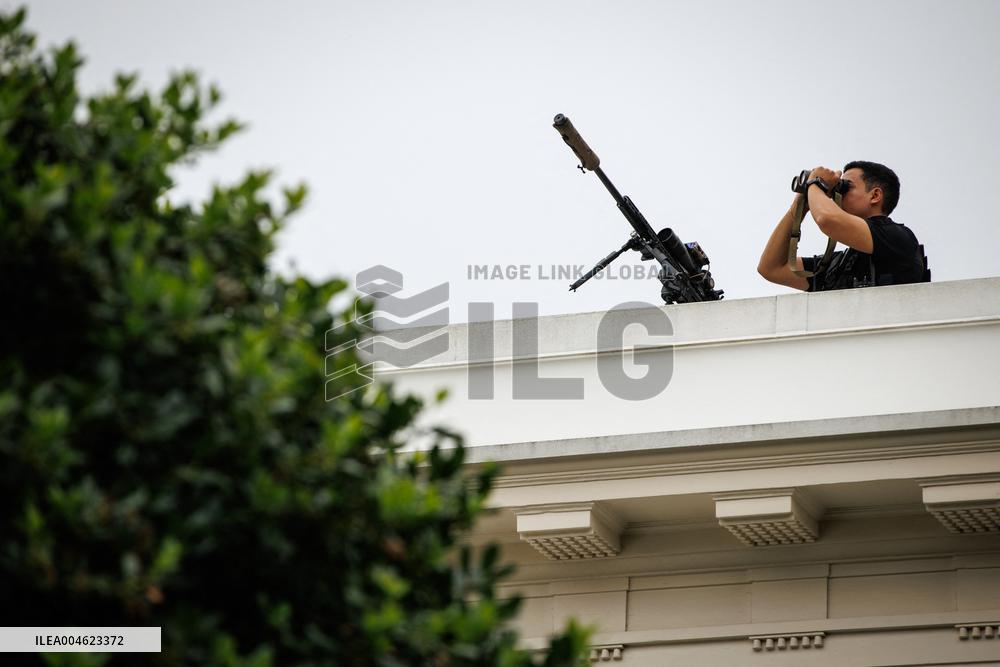 DC: President Trump walks on roof of the West Wing of the White House