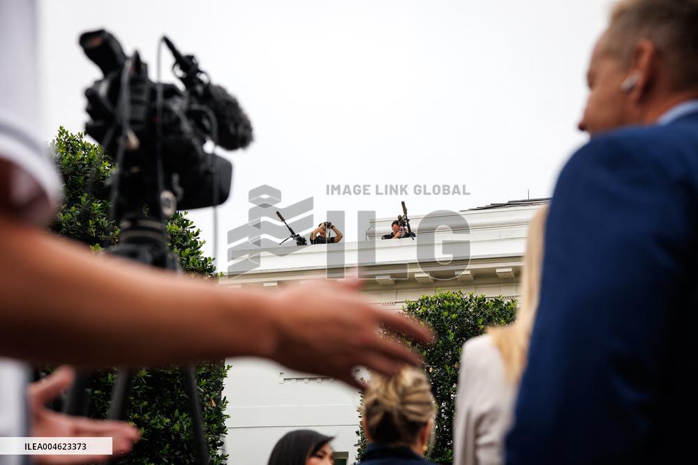 DC: President Trump walks on roof of the West Wing of the White House