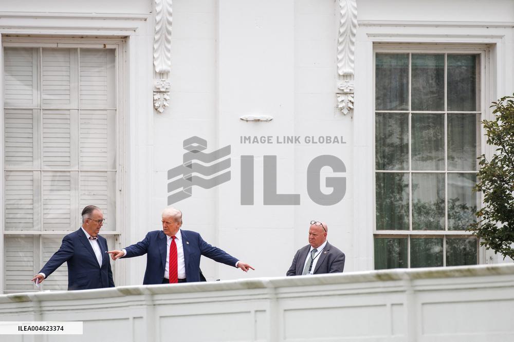 DC: President Trump walks on roof of the West Wing of the White House