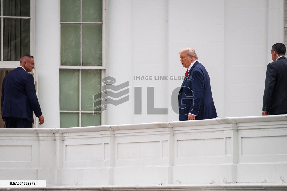 DC: President Trump walks on roof of the West Wing of the White House