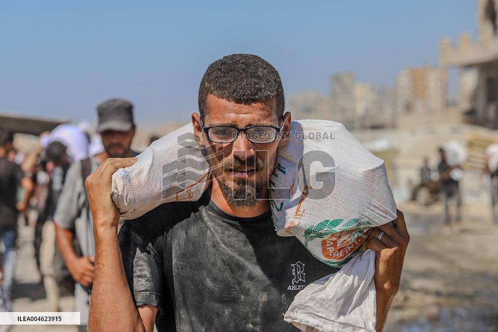 Gazans Flock to Aid Distribution Point - Gaza