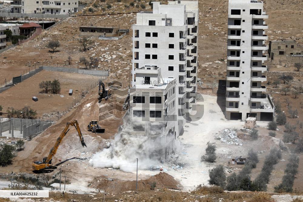 Israeli Excavators Demolish a Building - West Bank