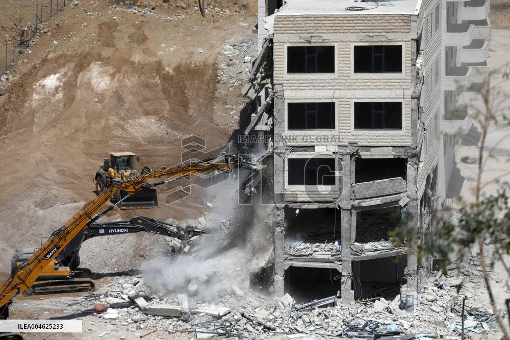 Israeli Excavators Demolish a Building - West Bank