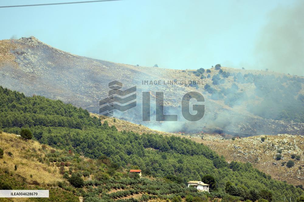 Fire Response in Santa Cristina Gela Helicopters Deployed - Italy
