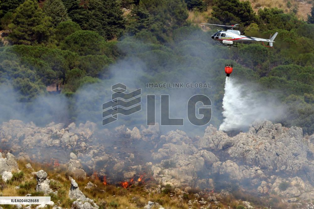 Fire Response in Santa Cristina Gela Helicopters Deployed - Italy