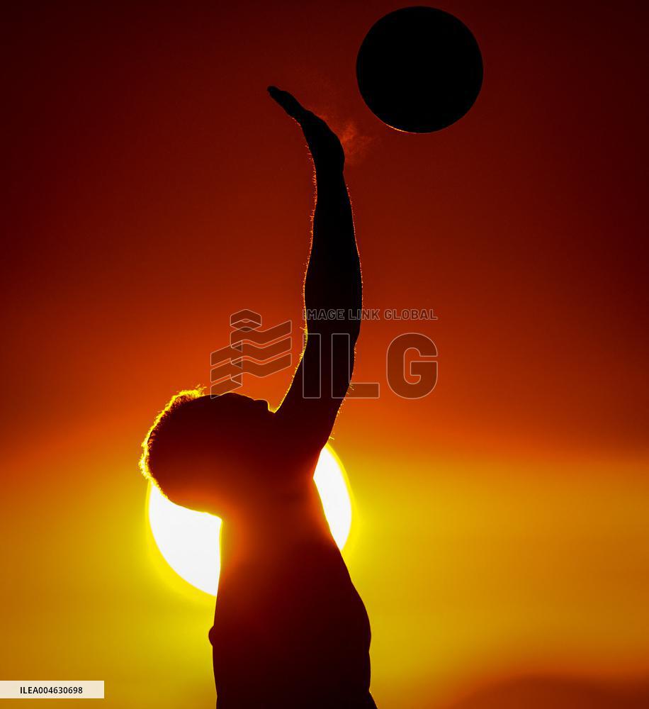 Illustration - Silhouetted at Sunset Amidst Vancouver Island Wildfires - Canada