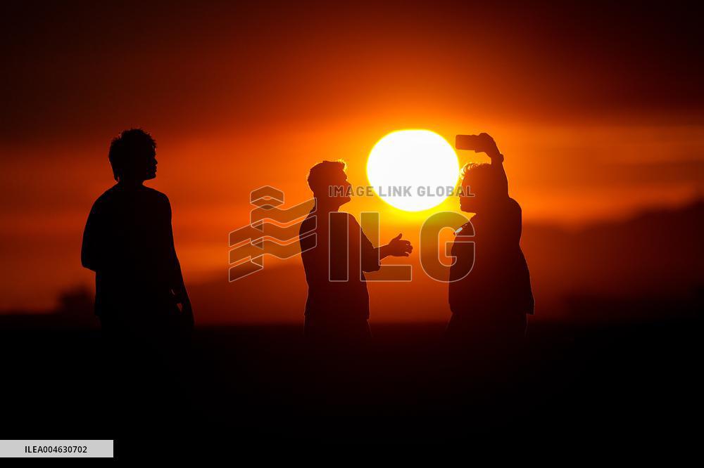 Illustration - Silhouetted at Sunset Amidst Vancouver Island Wildfires - Canada