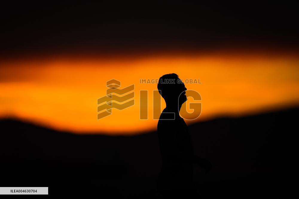 Illustration - Silhouetted at Sunset Amidst Vancouver Island Wildfires - Canada