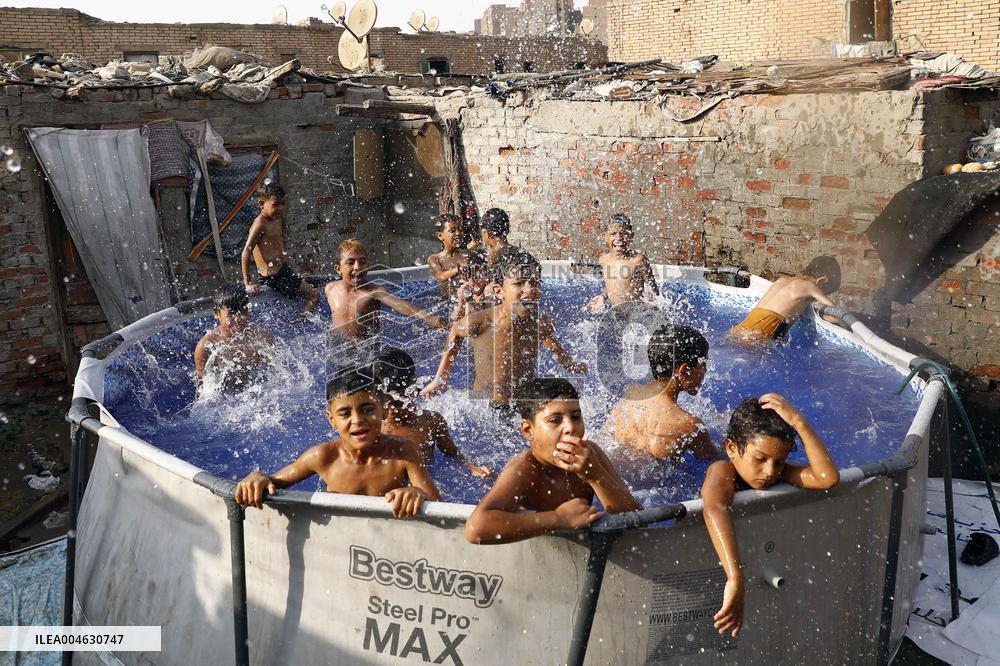 Boys Cool Off in A Pool During a Heatwave - Cairo