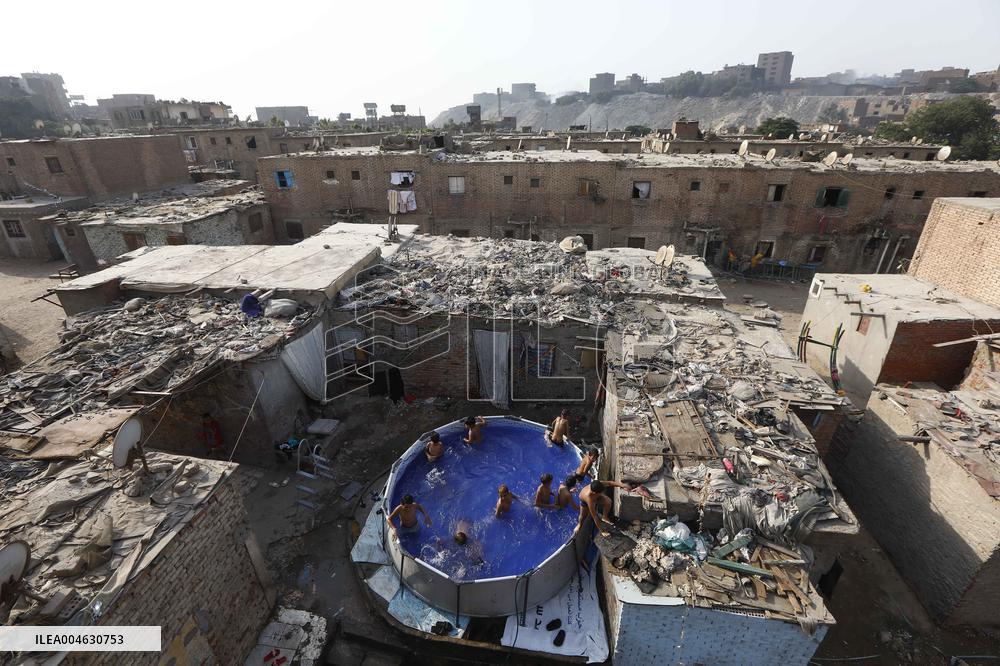 Boys Cool Off in A Pool During a Heatwave - Cairo